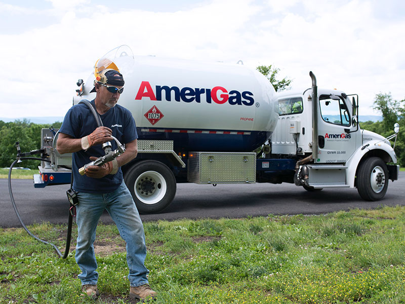 AmeriGas Truck with worker holding propane hose