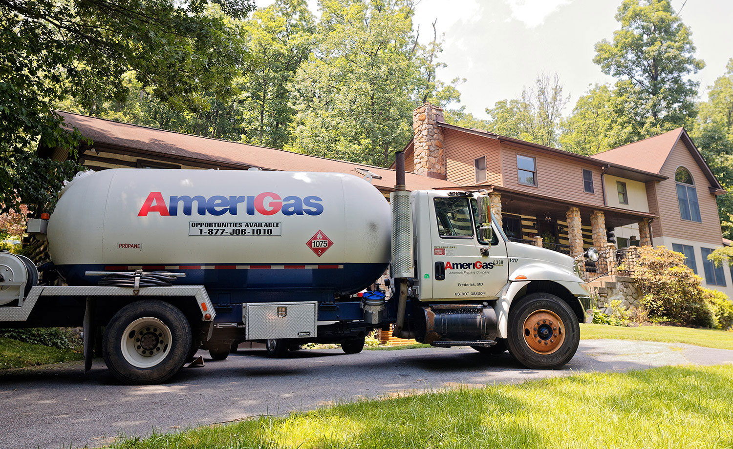 AmeriGas Tanker truck in front of a house.